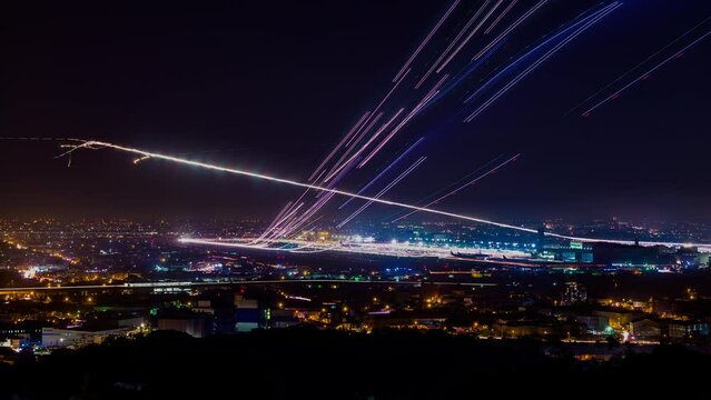 time-lapse photography asia International Airport, planes taking off and landing at night, make a long beautiful trail CKS internation airport taiwan