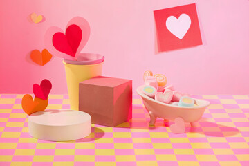 Colorful marshmallows in different shapes inside a mini tub, paper cups, paper hearts and platforms...