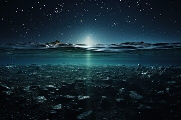 Fototapeta na wymiar an underwater view of rocks and water with a bright light shining on the surface of the water and stars in the sky.