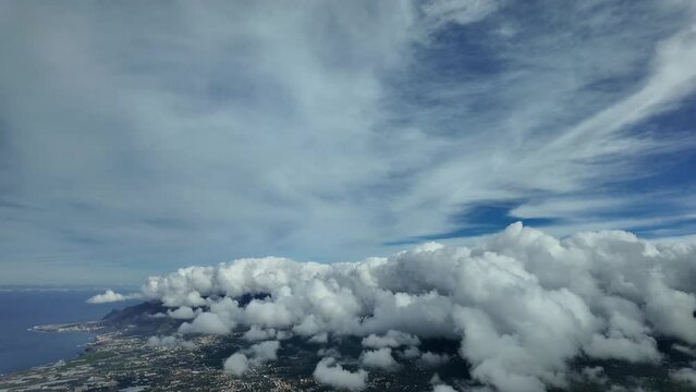 Approaching to Tenerife North airport, Canary Islands, Spain, in a real time approach to the complex airport, with the airport covered with clouds, as seen by the pilots.