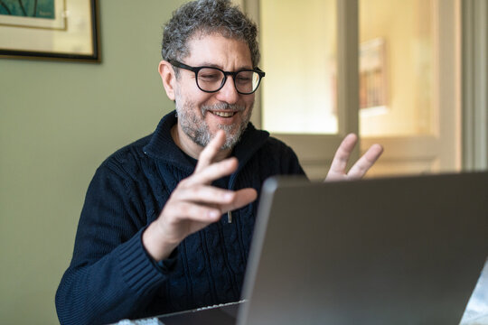Mature Man Enjoying a Video Call - Powered by Adobe