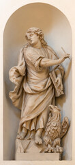 Fototapeta na wymiar VICENZA, ITALY - NOVEMBER 6, 2023: The carved satue of St. John the Evanglist in the church Chiesa di San Filippo Neri by Orazio Marinali (1643 – 1720).
