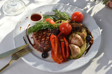 Grilled Steak Fillet with Vegetables, Sauce and Herbs