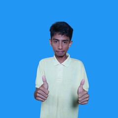 Asian man smiling face with okay gesture, isolated on blue background