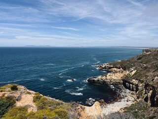 Beautiful rocky ocean coast, blue ocean horizon, natural ocean view