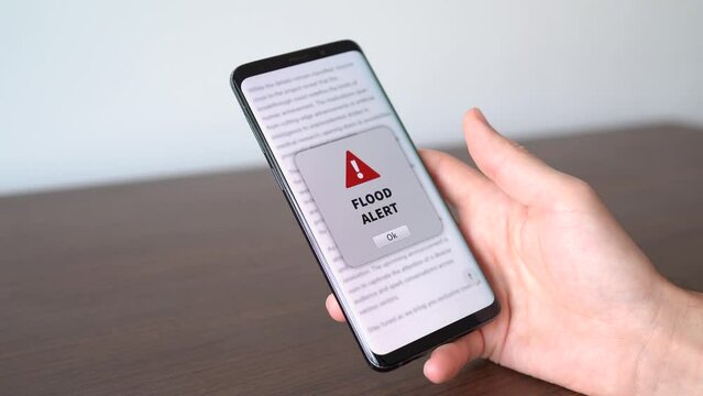 Flood alert notification appearing on the phone while in use.