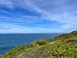 Fototapeta premium Beautiful rocky ocean coast, blue ocean horizon, natural ocean view
