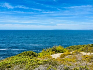 Beautiful rocky ocean coast, blue ocean horizon, natural ocean view