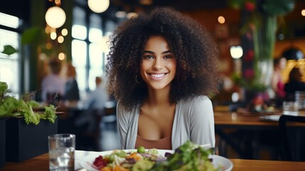 african american woman eating healthy food - obrazy, fototapety, plakaty