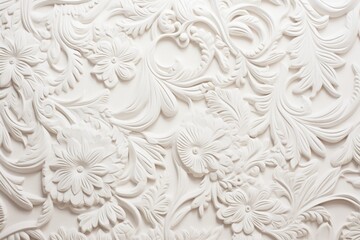  a close up of a white wall with a flower design on the side of it and a bird on the other side of the wall.