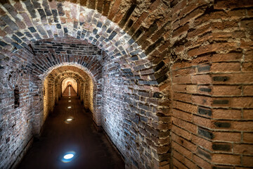 An ancient brick tunnel in the dungeon.
