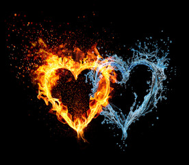 Water and fire. Two hearts made of fire and water on a black background with splashes of water and sparks of flame. Valentine's Day