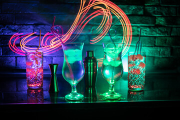 colorful cocktail in glass on dark background or Glasses of cocktails on bar background.Party club entertainment.