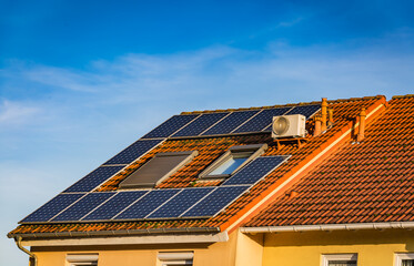 Fototapeta premium Photovoltaic panels on the roof of family house, solar panels.