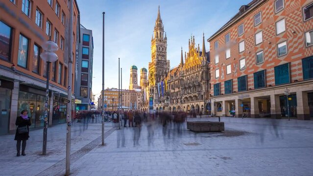 Hyperlapse Munich marienplatz sqaure main street in munich city germany moving forward time lapse hyperlapse footage in front munich town hall, munich frauenkriche church cathedral at sunset.