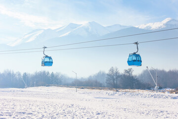 Bansko, Bulgaria Bulgarian winter ski resort panorama with gondola lift cabins, Pirin mountain peaks view - obrazy, fototapety, plakaty