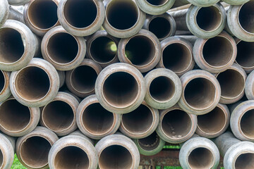A lot of straight metal pipes, tubes loaded on a trailer