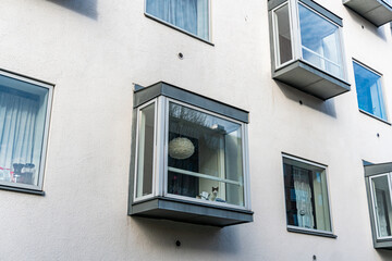 Modern contemporary residential building with square panoramic windows. Stylish and comfortable architecture.