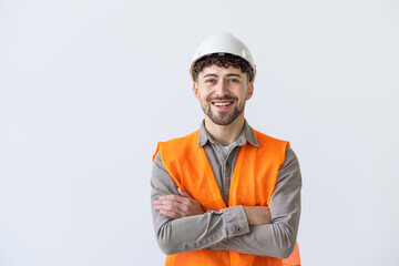Young construction workers in hard hats and hamlet on a white background