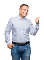 Middle age arab business man over isolated background smiling with happy face looking and pointing to the side with thumb up.
