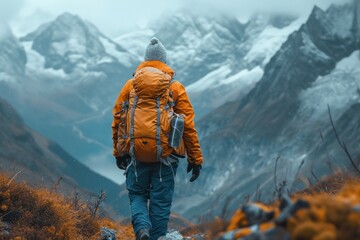 Solo hiker on a mountain trail enjoying the freedom and adventure of nature with a backpack under...