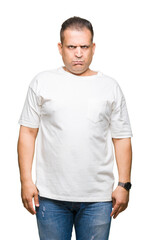 Middle age arab man wearig white t-shirt over isolated background skeptic and nervous, frowning upset because of problem. Negative person.