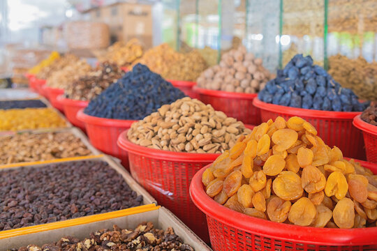 Colorful dried fruits and nuts at the Siab or Siyob bazaar (Siyob bozori). Samarkand, Uzbekistan, Central Asia