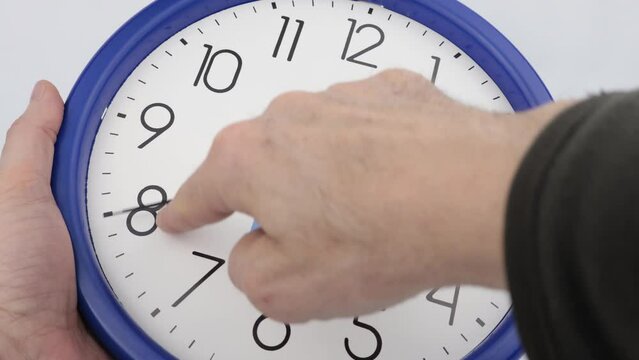Clock time lapse 24 hour wall clock with blue frame and white background.