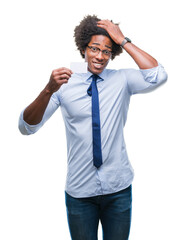 Fototapeta premium Afro american man holding visit card over isolated background stressed with hand on head, shocked with shame and surprise face, angry and frustrated. Fear and upset for mistake.
