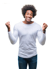 Afro american man over isolated background celebrating surprised and amazed for success with arms raised and open eyes. Winner concept.