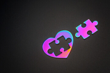 Disassembled Love: Colorful Heart with Puzzle Piece on Black