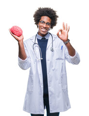 Afro american neurologist doctor or psychology man over isolated background doing ok sign with fingers, excellent symbol