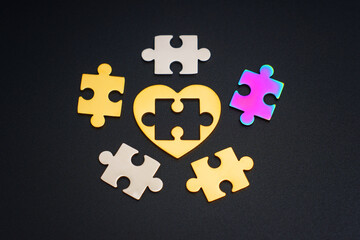 Golden Heart and Puzzle Pieces on Black