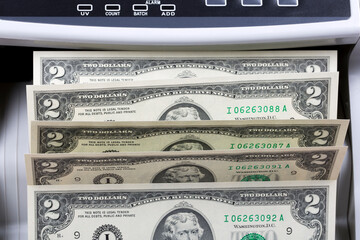 American two dollars in a counting machine