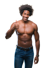 Afro american shirtless man showing nude body over isolated background doing happy thumbs up gesture with hand. Approving expression looking at the camera with showing success.