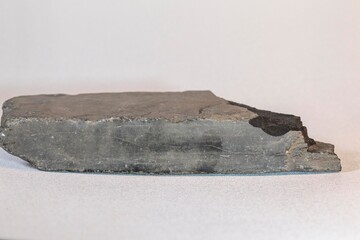 another outside angle of gray a flat brick shaped rock found many years ago