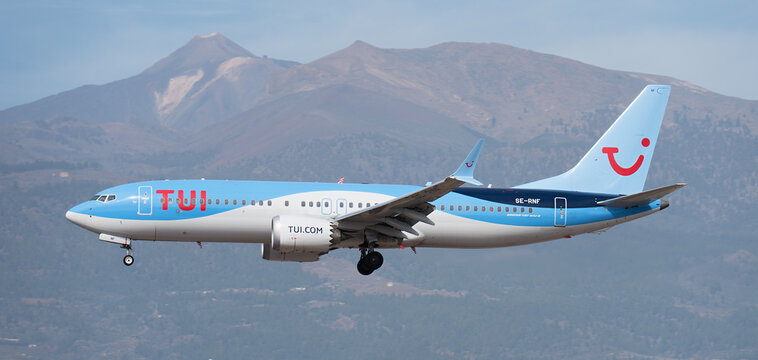Tenerife, Spain January 13 st, 2024.Boeing 737 MAX 8  TUI Airlines flies in the blue sky. Landing at Tenerife Airport. El Teide volcano in the background