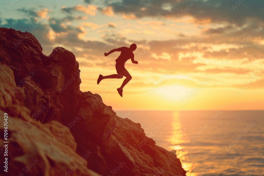 Poster A thrilling image capturing the moment a person jumps off a cliff into the refreshing ocean. Perfect for adventure and adrenaline-themed projects
