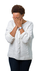 Beautiful young african american woman wearing sweater over isolated background with sad expression covering face with hands while crying. Depression concept.