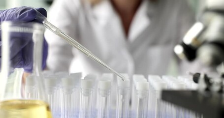 Oil dripping and chemicals mixing. Laboratory and scientific experiments and formulation of chemicals for medical research - Powered by Adobe