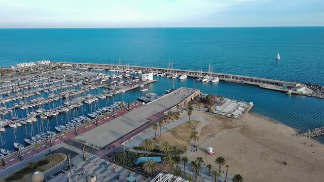 Aerial view of Barcelona Olympic Port and Mapfre Tower, Boats parked
