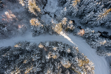 Aerial view of a nordic skiing path in the middle of a snowy mountain