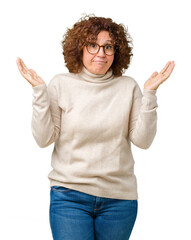 Beautiful middle ager senior woman wearing turtleneck sweater and glasses over isolated background...