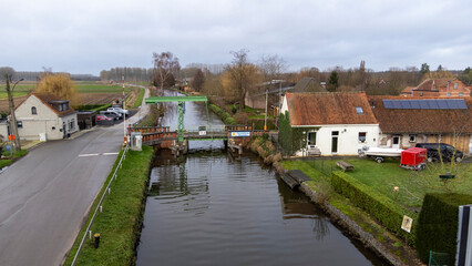 Fototapeta na wymiar drone images of bridges on the Moervaart river in Moerbeke, East Flanders, Belgium