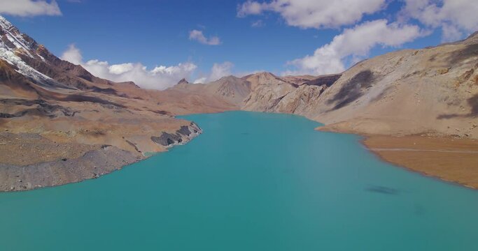 World's Highest altitude lake Tilicho at Nepal landscape hills shooting clouds and blue aesthetics, Manang Annapurna region beauty Tourism 4K