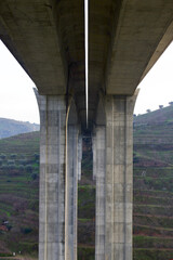 Bottom view of a reinforced concrete viaduct with two independent carriageways. A25 motorway in Portugal.