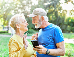 woman man outdoor senior couple retirement elderly phone fitness mobile smartphone music app communication active together love old nature using internet smart mature retired vitality healthy love