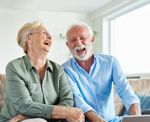 woman laptop man computer technology retirement senior adult couple home female wife husband internet male smiling elderly happy together mature old