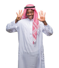 Young arabic african man wearing traditional keffiyeh over isolated background showing and pointing up with fingers number nine while smiling confident and happy.