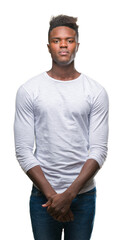 Fototapeta premium Young african american man over isolated background with serious expression on face. Simple and natural looking at the camera.